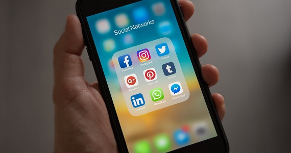 View of person's phone and their social media apps